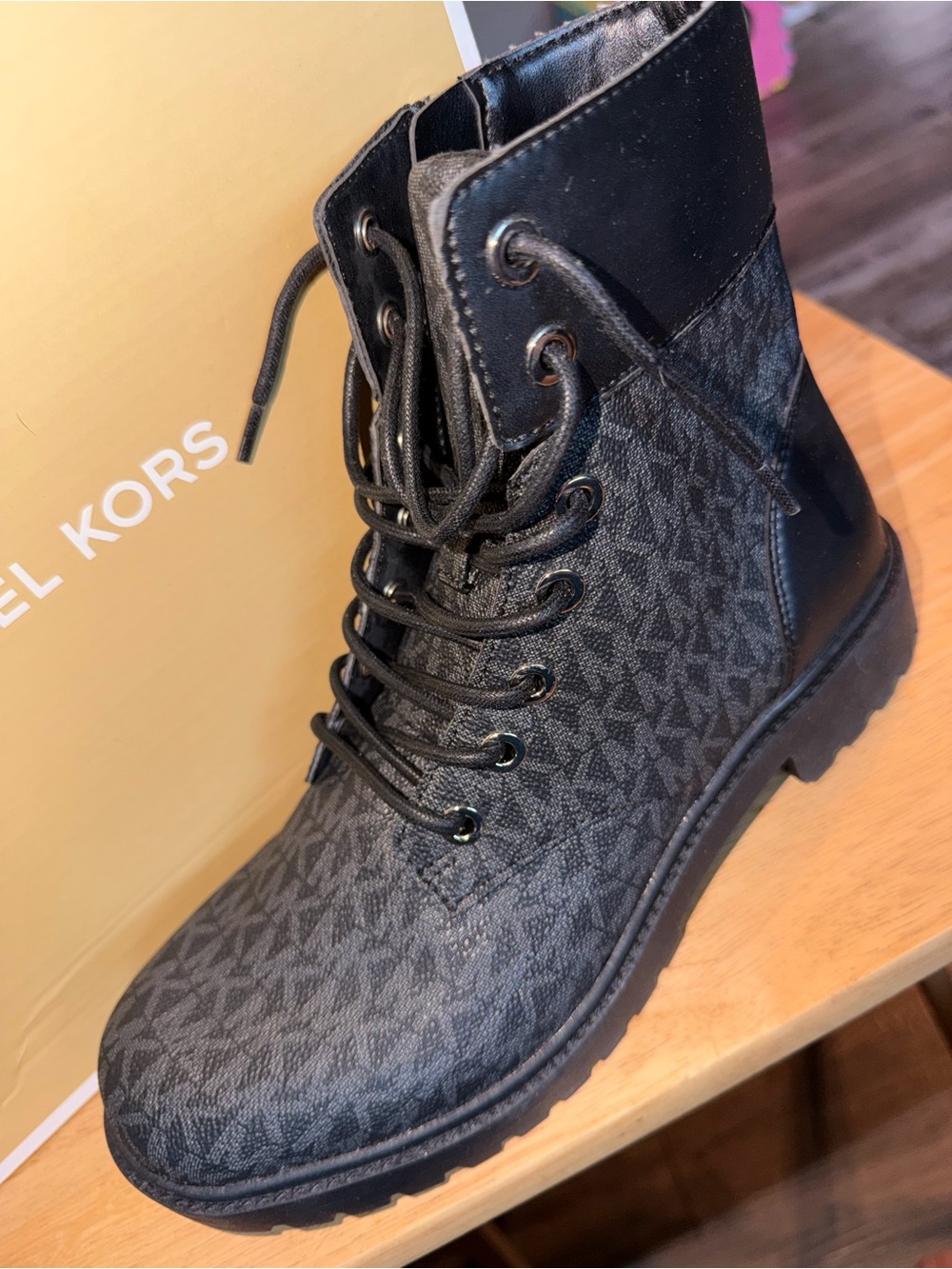 Michael Kors Black Monogram Alistair booties in black.